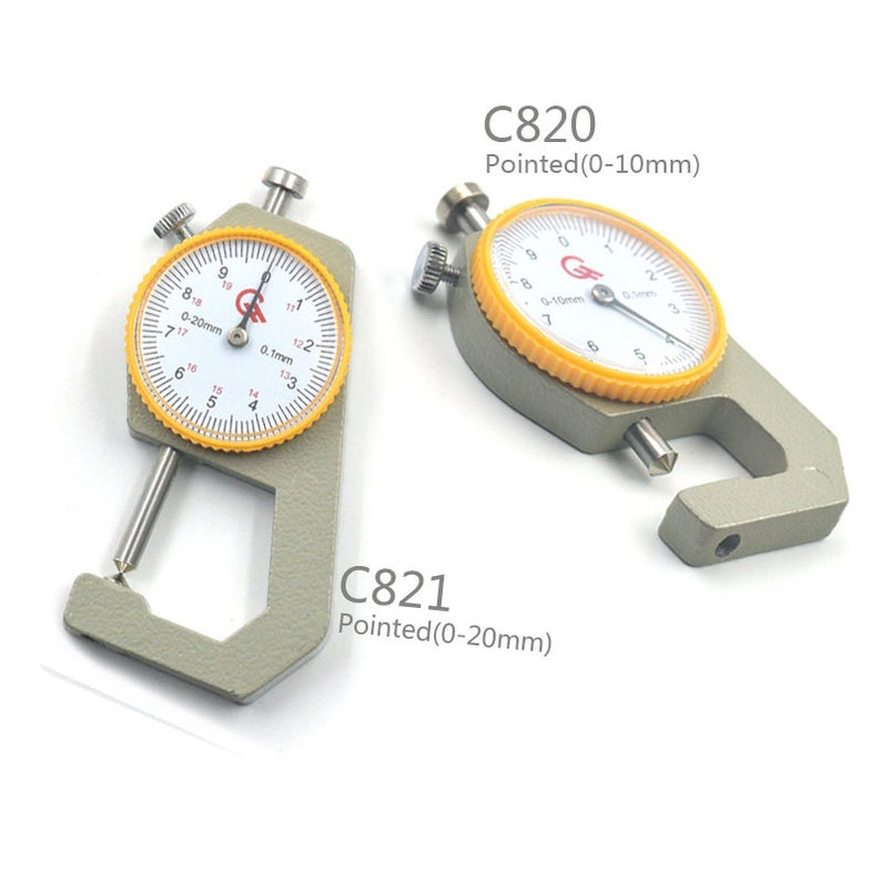 May include: Two gray metal calipers with yellow dials. The dial on the left caliper reads 0-20mm and the dial on the right caliper reads 0-10mm. The calipers are used to measure the thickness of objects.