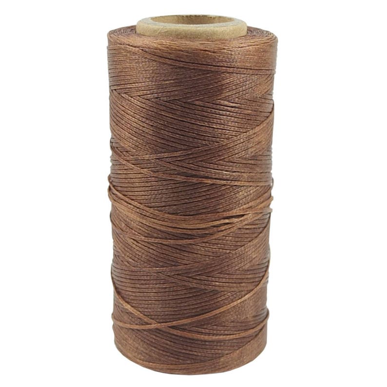 May include: A spool of brown waxed thread for leather crafting.