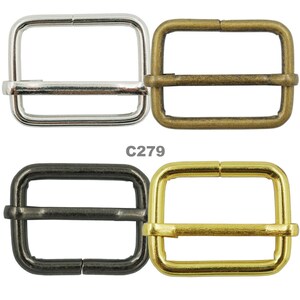May include: Four metal buckle slides in different finishes: silver, brass, black, and gold. The buckles are rectangular with a center bar and are commonly used for straps, belts, and bags.