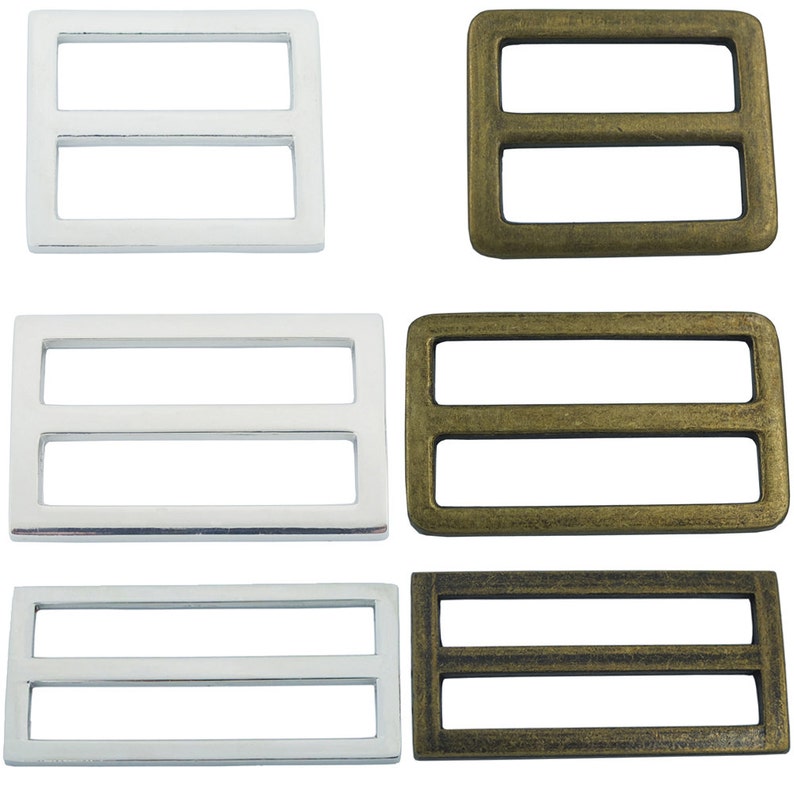 May include: Six metal slider buckles, three silver and three gold. The buckles are rectangular with two horizontal bars.