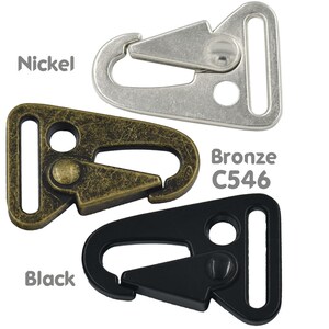 May include: Three metal swivel snap hooks in nickel, bronze, and black finishes. The bronze hook has the text "C546" printed on it.