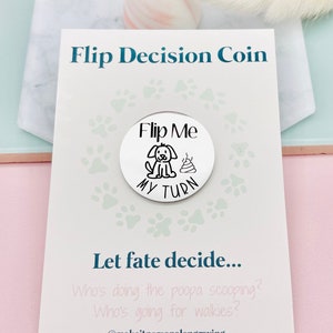 May include: A white card with the text "Flip Decision Coin" and a silver coin with a dog and poop illustration and the text "Flip Me My Turn". The card also has the text "Let fate decide... Who's doing the poopa scooping? Who's going for walkies? @makeitpersonalengraving"