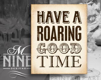 May include: A vintage-style printable sign with a tan background and brown text that reads "Have a Roaring Good Time".