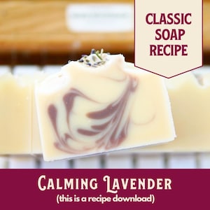 May include: A bar of calming lavender soap with a swirl pattern. The soap is white with purple swirls. The soap is on a wooden surface. "Classic Soap Recipe" and "Calming Lavender (this is a recipe download)" are written on the image.