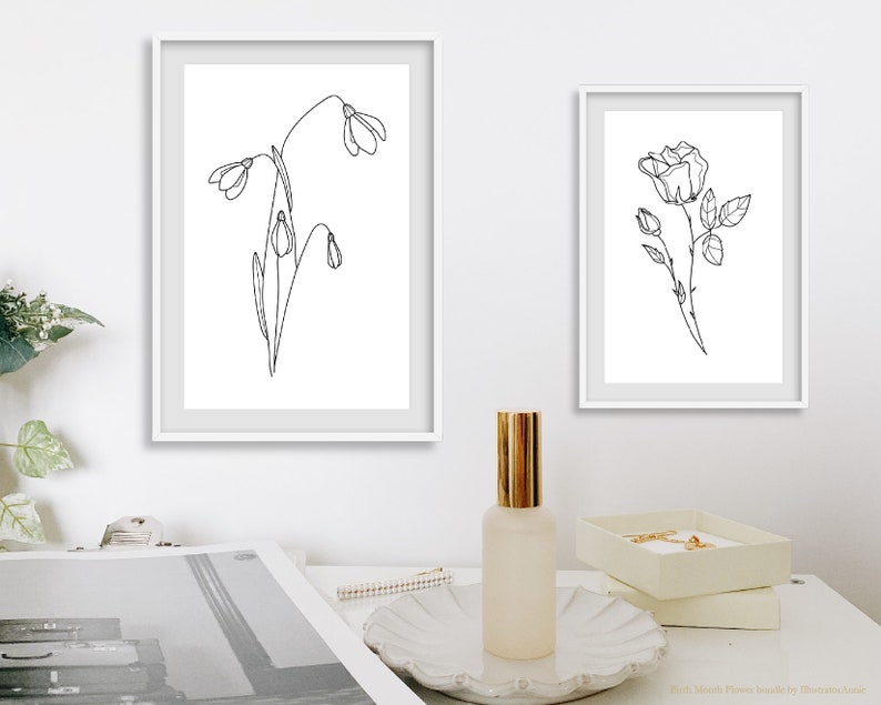 May include: Two black and white line drawings of flowers in white frames. The left frame shows a cluster of snowdrops. The right frame shows a single rose.