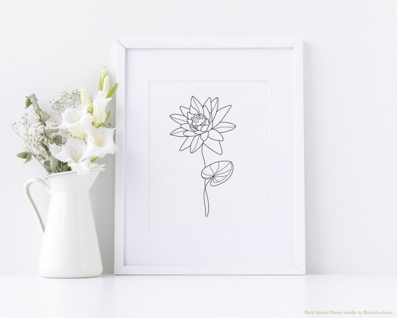 May include: A black and white line drawing of a water lily flower with a single leaf. The drawing is framed and displayed on a white wall.