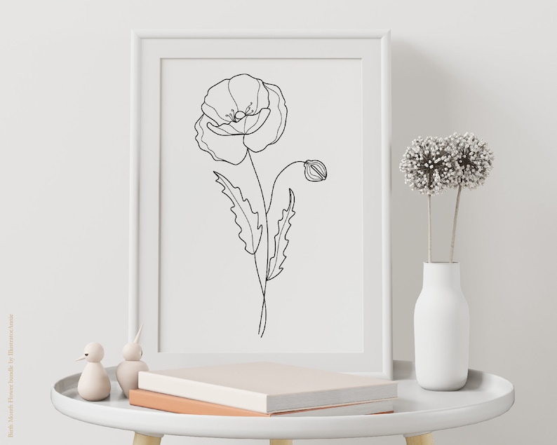 May include: A black and white line drawing of a poppy flower in a white frame on a white table with a white vase and dried flowers.