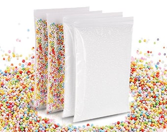 May include: Three clear plastic bags, two filled with colorful, small, round beads, and one empty. The beads are a mix of red, yellow, green, blue, and orange. The bags are on a white background, with scattered beads.