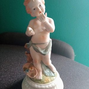 Vintage Bisque Cherub Baby On Round Base Figurine