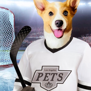 May include: A white hockey jersey with black and grey trim. The jersey has a grey patch with the text "Los Angeles PETS" and a crown logo. A dog wearing the jersey is holding a black hockey stick.