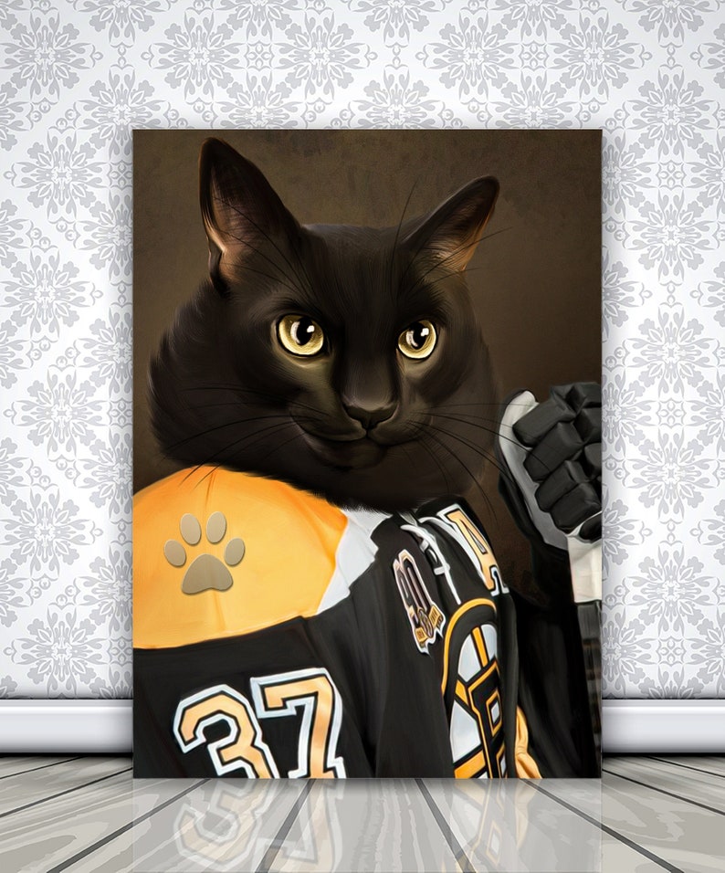 May include: A canvas print featuring a black cat wearing a hockey jersey with the number 37. The jersey is black, yellow, and white, with a paw print on the shoulder. The cat is holding a hockey stick and wearing a black glove.