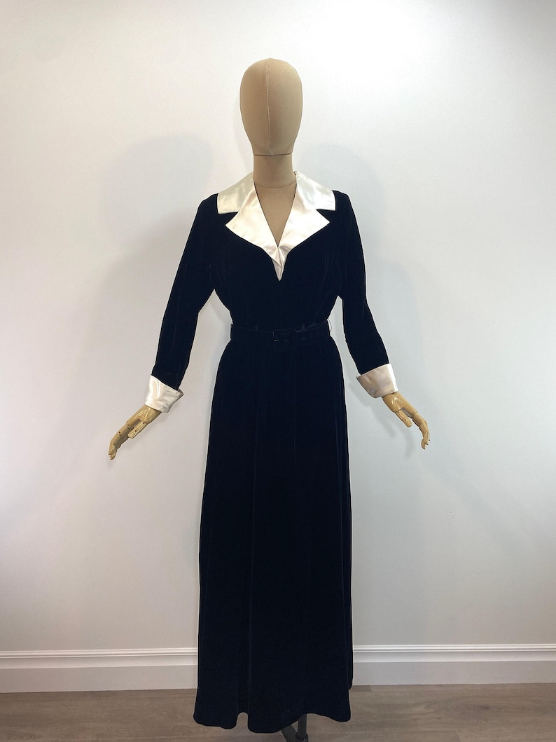 Vintage Black Velvet Maxi Dress 1940s Evening Gown Formal Wear Original Period Piece Ivory Satin Collar Wide Lapel Detail Fitted Bodice Gathered Skirt Special Occasion Attire Cocktail Party Dress Elegant Retro Fashion Classic Style Designer