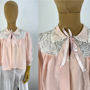Vintage 1950s Pale Pink Bed Jacket with Front Lace Yoke.  Single Curved Pocket and Tie at Neck Under Collar