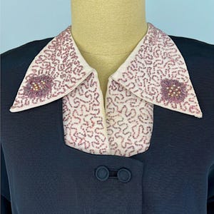 Vintage Black Faille Two Piece Evening Suit Late 1940s Early 1950s Beaded Collar Jacket Nipped Waist Formal Wear Retro Cocktail Attire Pearl Seed Bead Embellished Dusty Rose Details A Line Skirt Set Classic Mid Century Style Double Covered