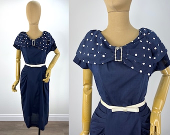 Vintage Late 1950s/Early 1960s Navy Blue Wiggle Dress with Pleated Navy with White Polka Dot Draped Collar and Rhinestone Buckle