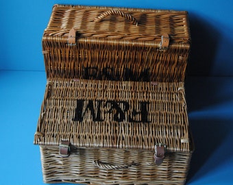 Selection of Fortnum & Mason wicker hamper baskets for summer picnics. Rustic farmhouse decor