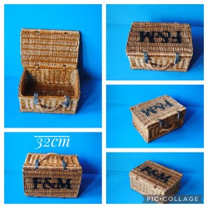 A collage showing 32cm Fortnum and Mason willow picnic basket from multiple angles. The basket is sitting on a blue surface, with the Fortnum and Mason logo visible at the top. The basket has an integrated willow handle to the front, plus a hinged lid that has two leather straps to hold the lid securely in-place