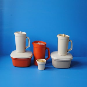 Vintage Tupperware containers - Microwave steamer in orange or taupe and tall pitcher in orange. Vintage kitchen utensils