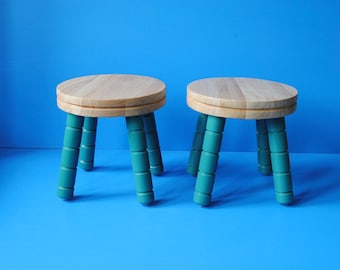 Chunky wooden milking stool with natural top and painted legs. Plant stand table for indoor plants. Low side table