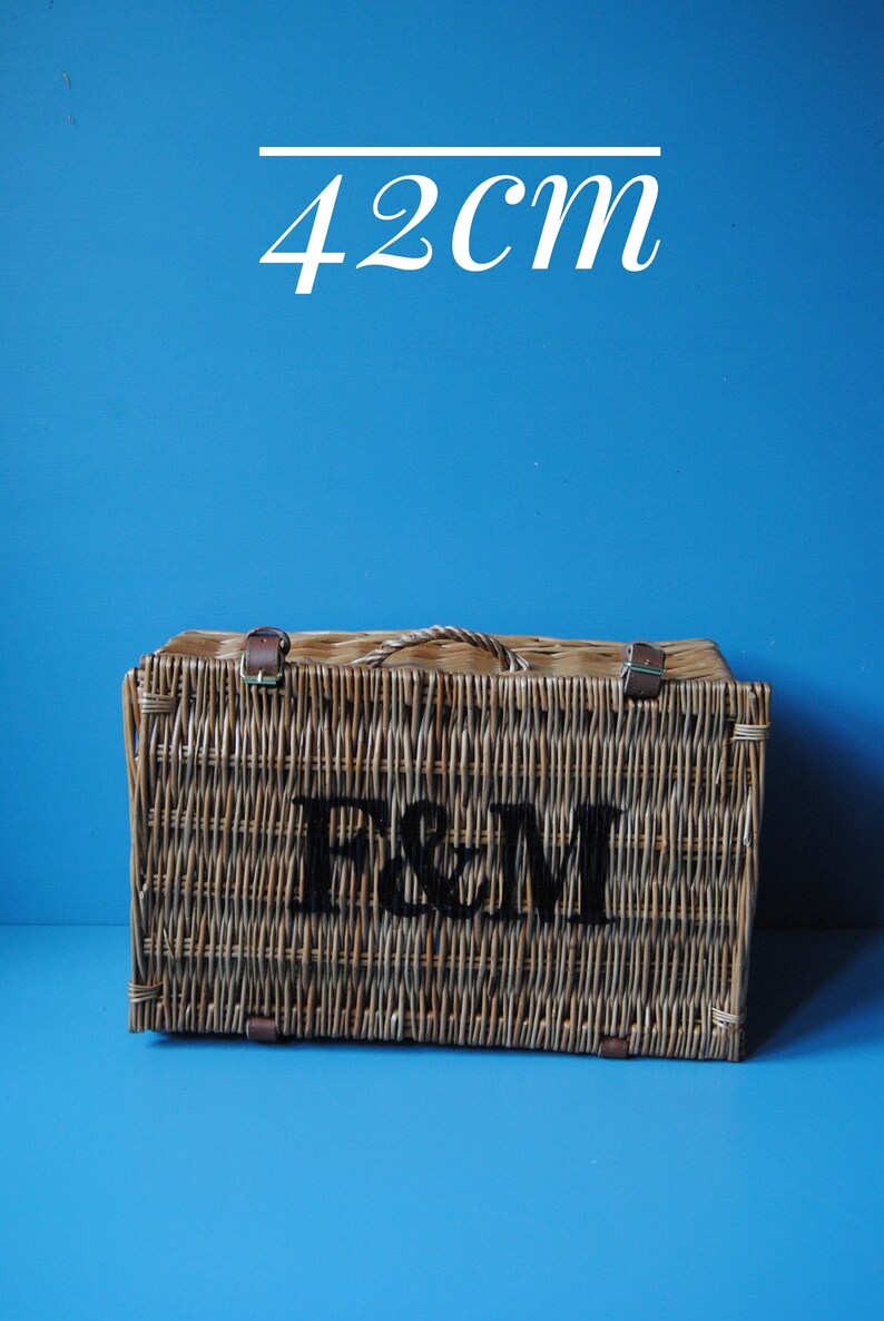 Selection of Fortnum & Mason wicker hamper baskets for summer picnics. Rustic farmhouse decor