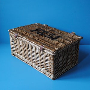 Selection of Fortnum & Mason wicker hamper baskets for summer picnics. Rustic farmhouse decor