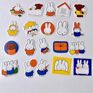 May include: A selection of colourful stickers featuring a white rabbit character in various poses and settings. The stickers include images of the rabbit with a teddy bear, in a bathtub, and holding a balloon. The stickers are on a white background.