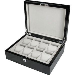 May include: Open, black, high-gloss watch box with a light grey interior. The box has eight compartments for watches, each with a soft, padded cushion. The lid is open, revealing the interior. The box has a silver-coloured lock.