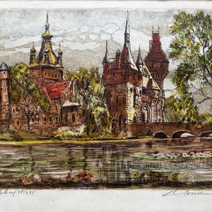 May include: A colored etching print depicting a castle with multiple towers and spires situated behind a body of water with a stone bridge. The artwork features earthy tones of brown, green, and red, with handwritten text at the bottom left and right.