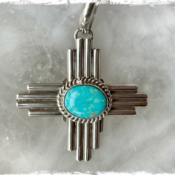 Native American sterling silver Zia Symbol with turquoise pendant by artist Robert Yellowhorse