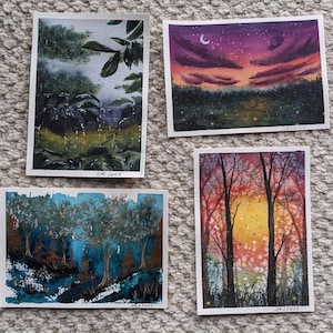 Könnte beinhalten: Vier Aquarell-Landschaftsbilder. Eines zeigt eine Waldszene mit Regen, ein anderes einen Sonnenuntergang mit einem Halbmond, und zwei weitere zeigen Bäume. Jedes Gemälde hat einen weißen Rand und das Datum "10/4/2023" steht unten.