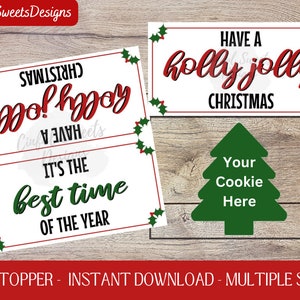May include: Two printable Christmas bag toppers with red and green holly designs. The first topper says "Have a holly jolly Christmas" and the second topper says "Have a holly jolly Christmas, it's the best time of the year".