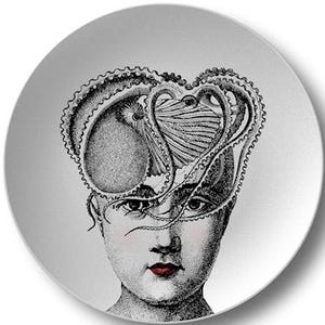 May include: A decorative plate featuring a black and white illustration of a person with an octopus-like design replacing the brain. The person has red lips and the letter "B" is at the bottom left.
