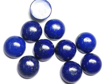 May include: A collection of ten round, cabochon-cut lapis lazuli gemstones. The stones are a deep blue color with flecks of gold pyrite. The stones are arranged in a pyramid shape.