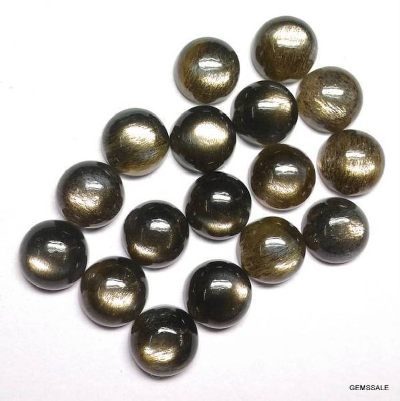 May include: A collection of 15 round, cabochon cut, black sunstone gemstones. The stones have a golden sheen and are approximately 10mm in diameter.