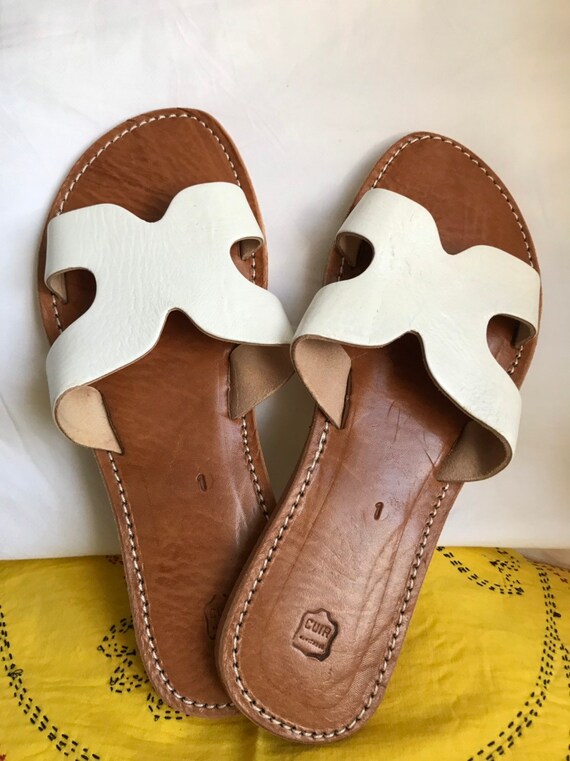 white leather slip on sandals