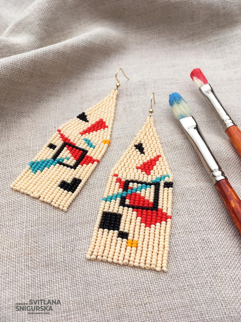 Abstract geometric seed bead earrings inspired by Bauhaus design, featuring ivory, black, red and turquoise color blocks with 18K gold-plated ear hooks.