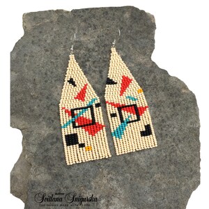 Abstract geometric seed bead earrings inspired by Bauhaus design, featuring ivory, black, red and turquoise color blocks with 18K gold-plated ear hooks.