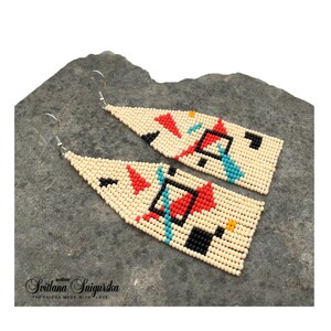 Abstract geometric seed bead earrings inspired by Bauhaus design, featuring ivory, black, red and turquoise color blocks with 18K gold-plated ear hooks.