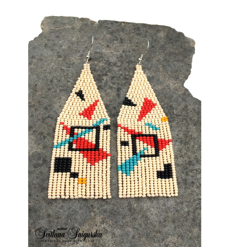 Abstract geometric seed bead earrings inspired by Bauhaus design, featuring ivory, black, red and turquoise color blocks with 18K gold-plated ear hooks.