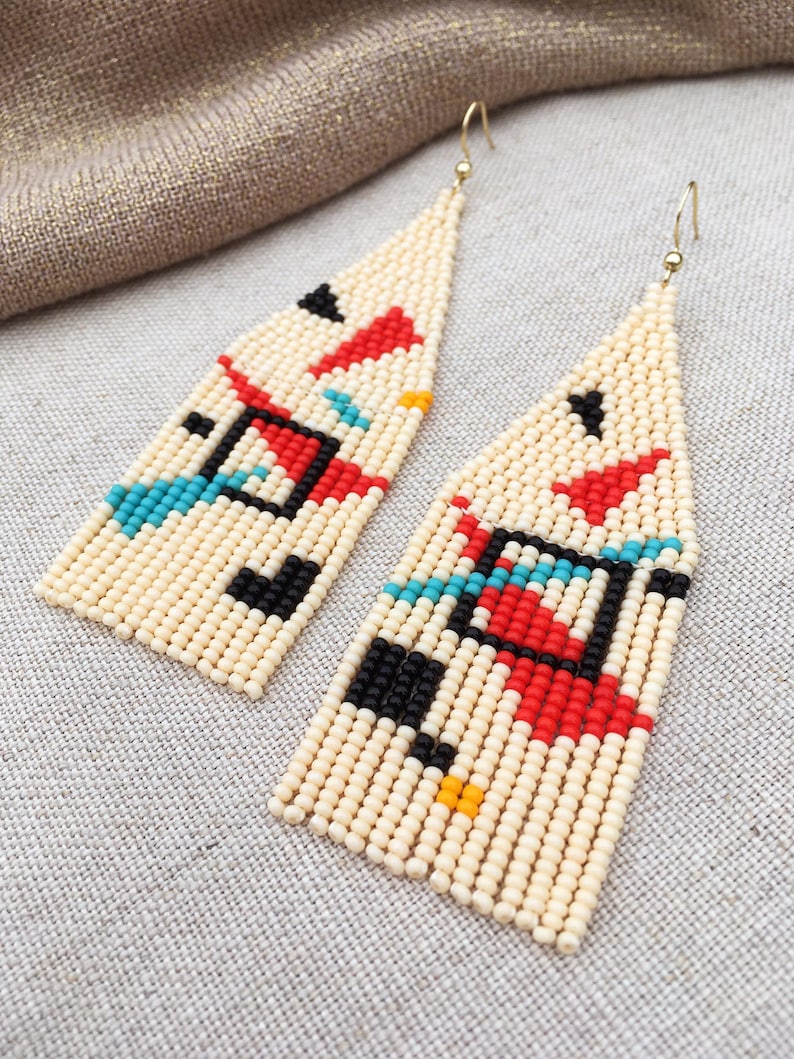 Abstract geometric seed bead earrings inspired by Bauhaus design, featuring ivory, black, red and turquoise color blocks with 18K gold-plated ear hooks.