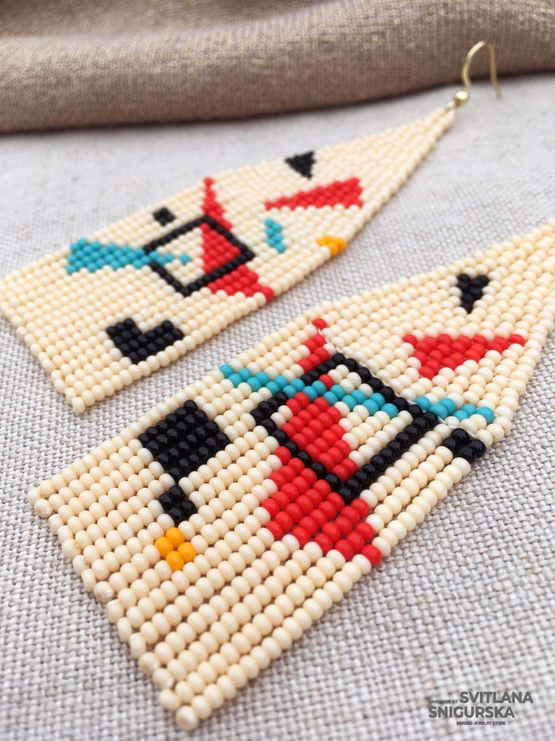 Abstract geometric seed bead earrings inspired by Bauhaus design, featuring ivory, black, red and turquoise color blocks with 18K gold-plated ear hooks.