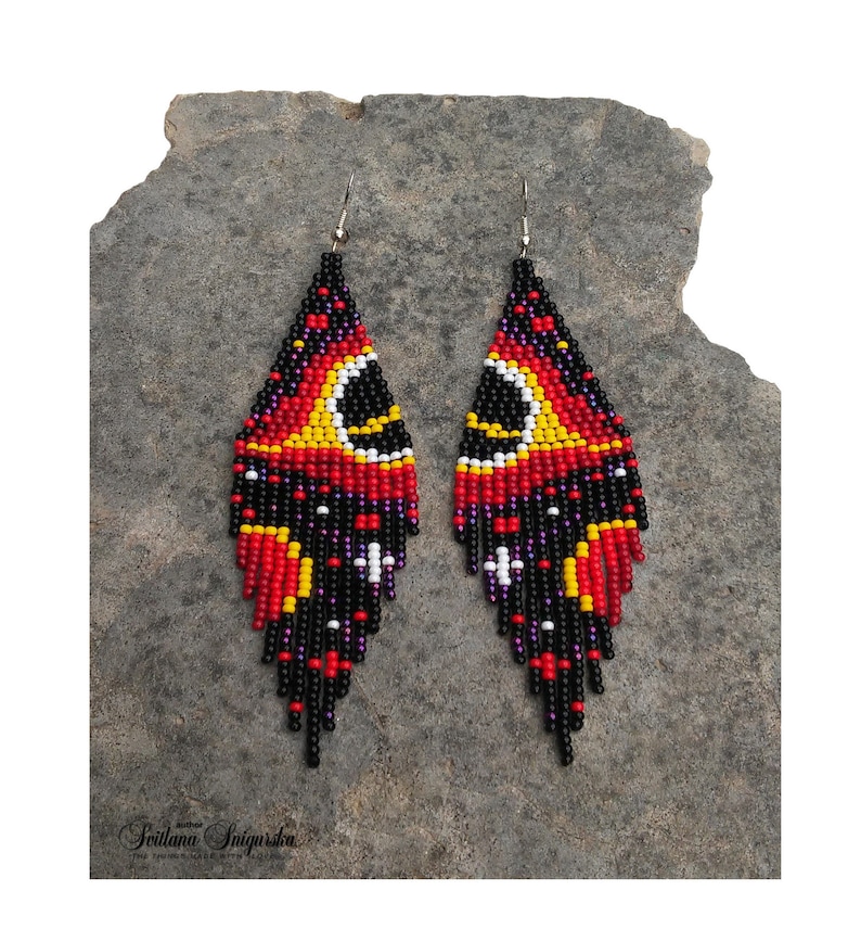 Handwoven black hole beaded earrings with red, gold and black cosmic galaxy design, long fringe seed bead statement jewelry on silver-plated hooks.