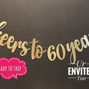May include: Gold glitter banner with the text "Cheers to 60 years" and a pink speech bubble with the text "Ready to Ship". Below the banner is the text "Ur Envited Too".