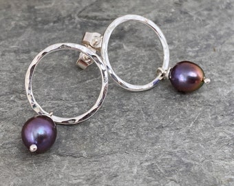 Round stud earrings with peacock freshwater pearl drops, hammered silver rings with a wire wrapped pearl dangle.