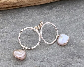 Open circle stud earrings with pink keshi  pearl drops, hammered silver rings with a wire wrapped pearl dangle.