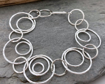 Unique hammered silver chain bracelet with large round open links with circles inside