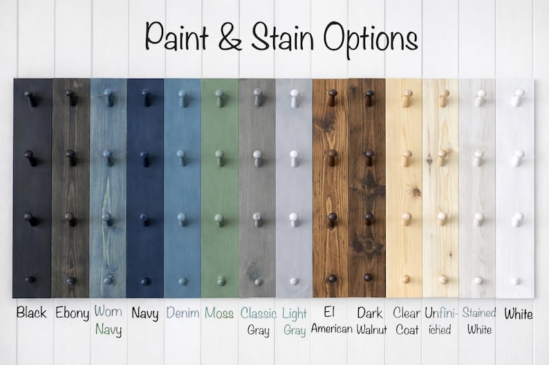 May include: A selection of wooden planks showcasing paint and stain finishes. Colours range from black and navy to moss and grey, with options like walnut. Each plank features pegs. The text at the top says "Paint & Stain Options."