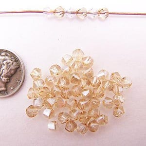 Golden Shadow (4mm) Swarovski 5020 Faceted Crystal Beads