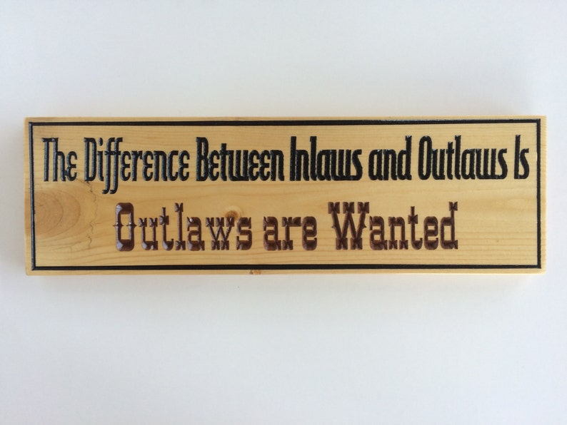 The Difference Between Inlaws and Outlaws Wood Carved Sign Etsy