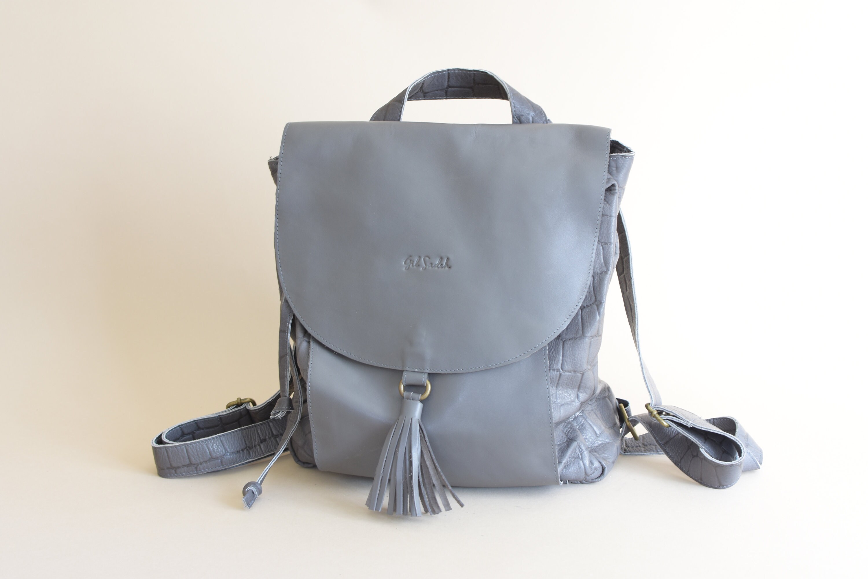 light grey leather backpack